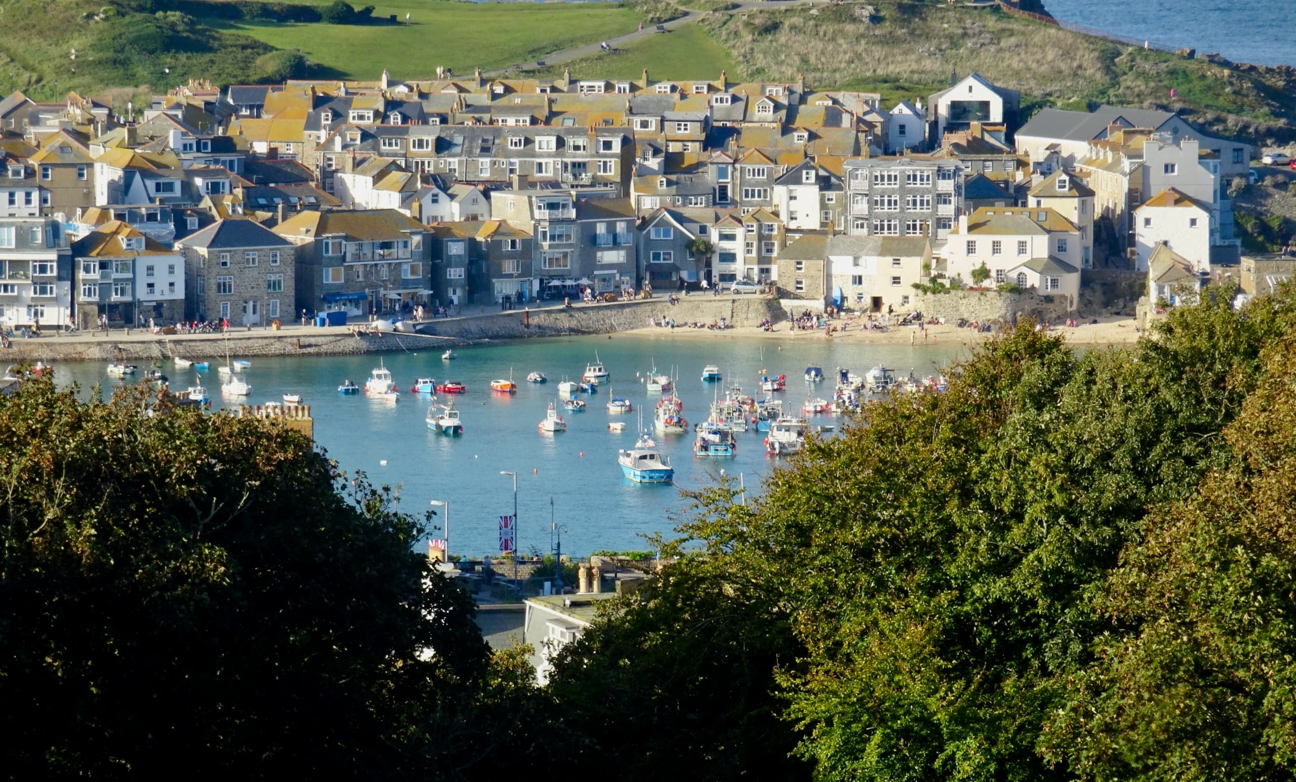 St Ives harbour, with boats moored below the town