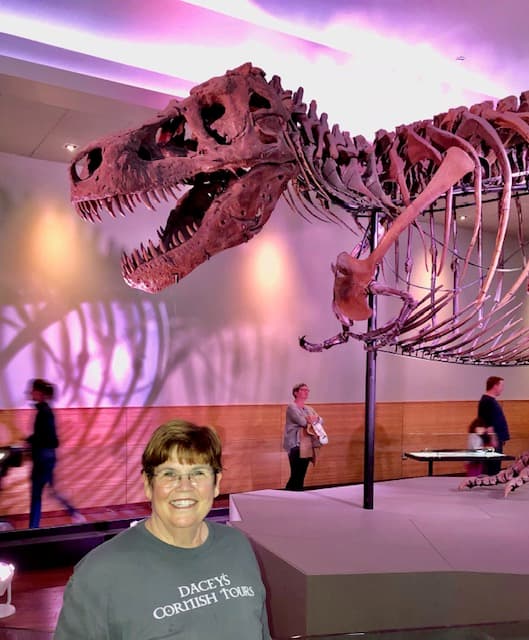 Suzanne, standing with T-Rex, at Field Museum, Chicago