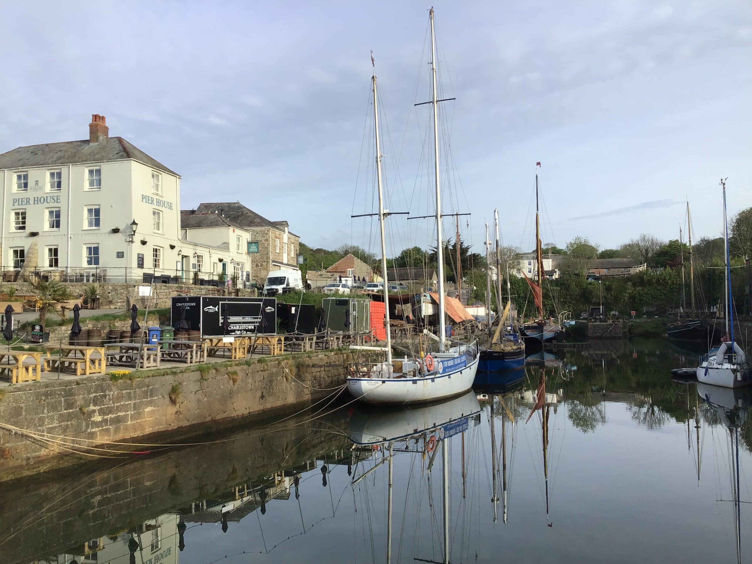 Tall ships moored in Charlestown harbour beside the Pier House