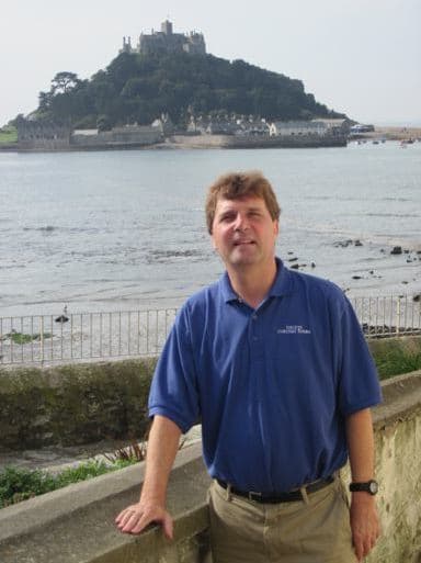 David “Dacey” Warner standing above the sea with St Michael’s Mount behind him