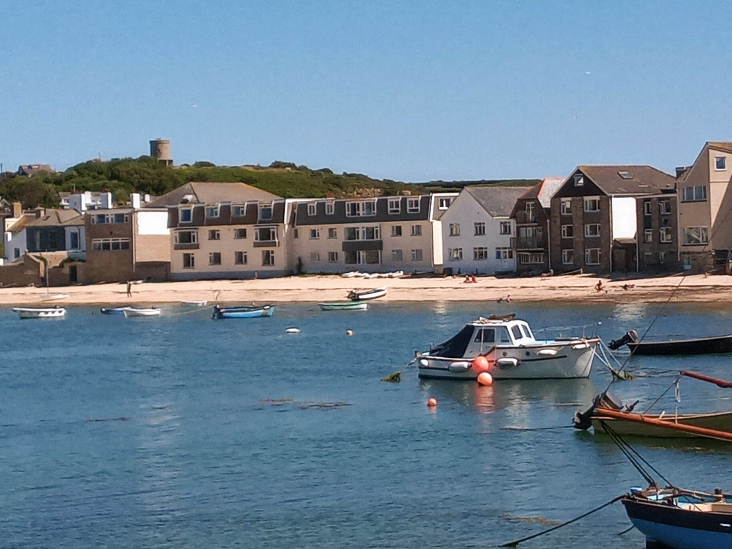 Boats in the harbour in front of the seafront houses on St Mary’s