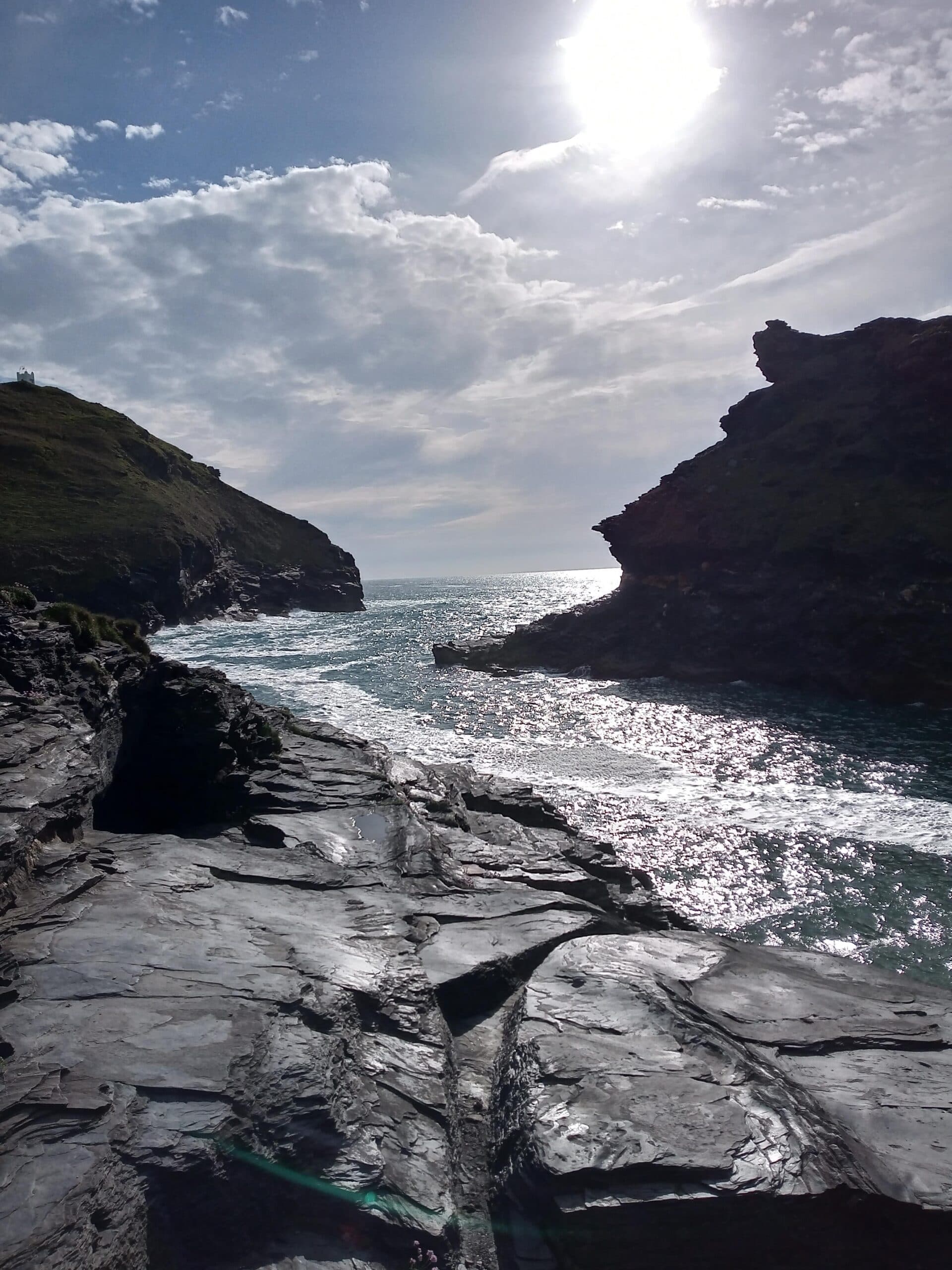 The Atlantic surging between dark rocks on the North Cornwall coast