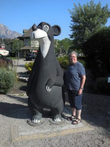 Dacey's Cornish toursKaren, standing with Jasper the Bear, Alberta, Canada